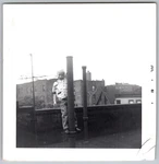 Vtg B&w Snapshot Boy Climbing Metal Pole Rooftop Urban City Tenement 1961. Fixed Price $7.99.